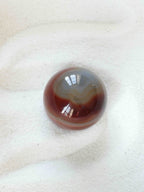 Sphere en Agate - Pierre pour le courage & la chance - SOLYA - Bijoux, Cristaux et mineraux en Belgique - Boutique de pierres naturelles et ethiques